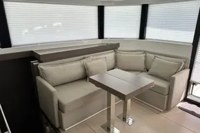 Luxurious interior of 2025 Robertson and Caine Leopard 46 Powercat with modern seating and table.