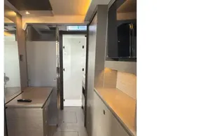 Modern interior of 2025 Leopard 46 yacht, featuring sleek cabinetry and ambient lighting.