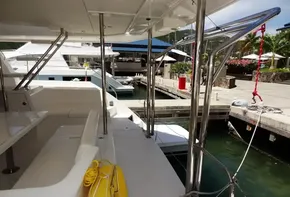 2017 Leopard 43 Powercat docked at marina, view of deck and seating area.