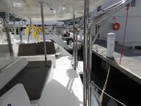 Leopard 40 catamaran docked, featuring outdoor seating and polished metal railings, 2021 model.