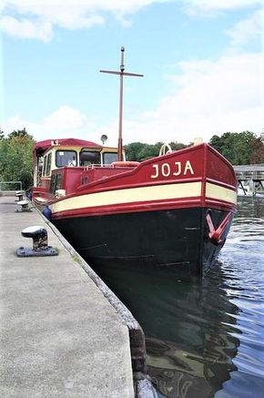 Classic 1927 Dutch Barge moored at the dock.