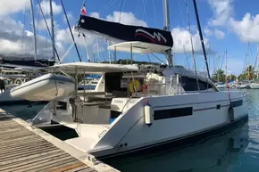 2020 Leopard 40 catamaran docked at marina, featuring sleek design and spacious deck.