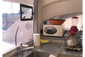 Modern kitchen interior on a 2020 Leopard 40 yacht, featuring appliances and a sleek design.
