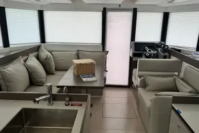 Luxurious interior of 2024 Leopard 40 Powercat with modern seating and helm station.