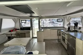 Modern interior of 2021 Leopard 50 yacht with kitchen and seating area.