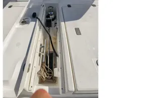 2021 Leopard 50 yacht deck with open storage compartment and winch system.