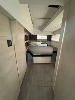 Interior of 2020 Leopard 50 yacht cabin with bed and modern design.