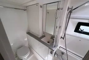 Modern bathroom in a 2019 Leopard 45 yacht with shower, toilet, and sink.