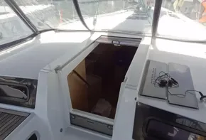 Cockpit view of 2020 Beneteau Oceanis 46.1 sailboat with open hatch.