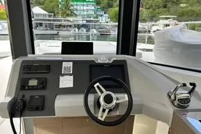 Helm of 2022 Leopard 53 Powercat with modern controls and navigation equipment.