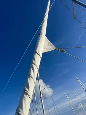 Sailboat mast and rigging against clear blue sky, Leopard 45, 2019 model.