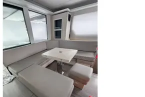 Luxurious interior of 2019 Leopard 50 yacht with modern seating and table.