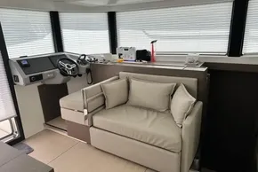 Interior of 2025 Robertson and Caine Leopard 46 Powercat with helm and seating area.