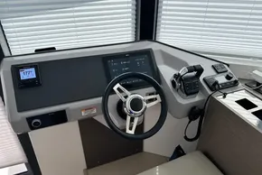 Helm station of 2025 Robertson and Caine Leopard 46 Powercat with modern navigation controls.