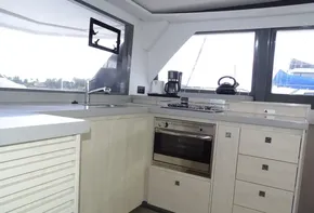 Modern kitchen interior on 2017 Leopard 45 yacht with appliances and ample storage.