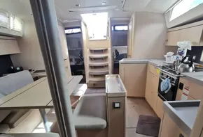 Interior of 2020 Beneteau Oceanis 46.1 yacht, featuring modern kitchen and seating area.