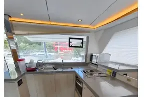 Modern kitchen interior on a 2020 Leopard 45 yacht, featuring sleek countertops and appliances.