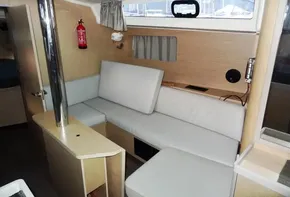 2017 Beneteau Oceanis 41 interior with light wood finish and white seating.