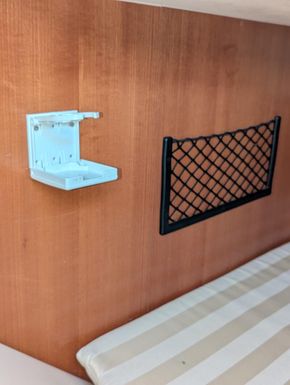 Port aft cabin cupholder & storage netting