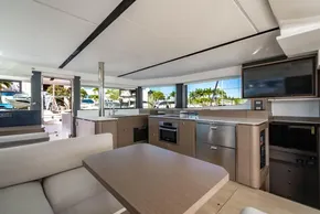 Luxurious interior of 2025 Leopard 46 yacht with modern kitchen and seating area.