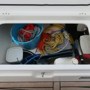 Storage compartment on 2018 Beneteau Oceanis 51.1 yacht with ropes and equipment.
