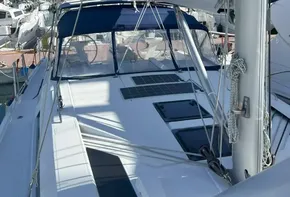 2020 Beneteau Oceanis 46.1 sailboat docked in marina, blue sail cover visible.