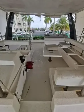 Interior of a 2017 Leopard 43 Powercat yacht with seating and table.