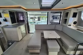 Luxurious interior of a 2020 Leopard 45 catamaran with modern seating and sleek design.