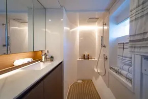 Luxurious yacht bathroom with modern fixtures, elegant lighting, and sleek design, Leopard 50, 2022 model.