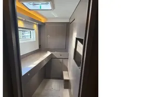 Modern interior of 2025 Leopard 46 yacht with sleek cabinetry and natural lighting.