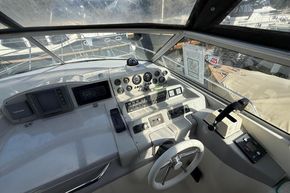 Cockpit of 1991 Sealine 290 Ambassador boat with steering wheel and control panel.