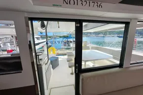Interior view of 2021 Leopard 50 yacht with open sliding doors to deck.