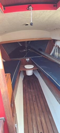 Folkboat with metal mast and boom