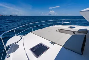 2025 Leopard 40 Powercat deck with sun loungers, ocean view, and clear blue sky.