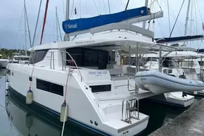 2022 Leopard 45 catamaran docked, featuring Sunsail branding and inflatable dinghy.