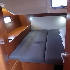 Cozy cabin interior of 2018 Beneteau Oceanis 51.1 yacht with comfortable bed.