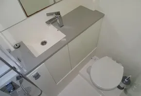 Modern bathroom in 2017 Leopard 45 yacht with sink and toilet.