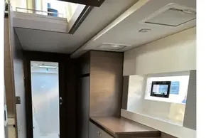 Interior of 2022 Leopard 42 yacht with modern wood finish and compact design.