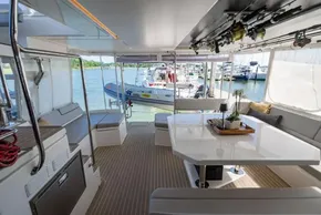 Luxurious interior of 2022 Leopard 50 yacht with elegant seating and dining area.