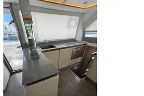 Modern kitchen interior on 2020 Leopard 50 yacht, featuring sleek countertops and cabinetry.