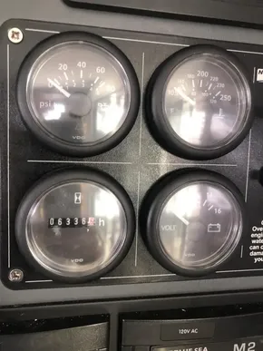 Control panel of a 2021 Leopard 45 with gauges displaying pressure, temperature, hours, and voltage.