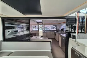 Modern interior of a 2020 Leopard 45 catamaran, featuring a spacious kitchen and seating area.