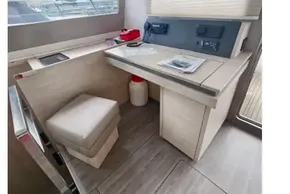 Interior of 2019 Leopard 50 yacht with navigation station and seating area.
