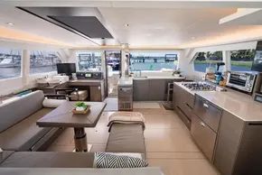 Luxurious interior of 2022 Leopard 50 yacht with modern kitchen and spacious seating area.