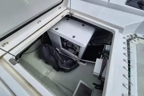 Open compartment on Leopard 45 yacht, showcasing interior equipment and storage space.