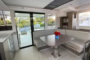 Interior of 2022 Leopard 42 yacht with dining area and modern decor.