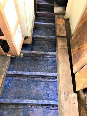 Interior of a classic 1927 Dutch Barge with wooden flooring.