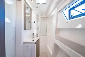 Modern bathroom interior on a 2025 Leopard 46 yacht, featuring sleek design and ample natural light.