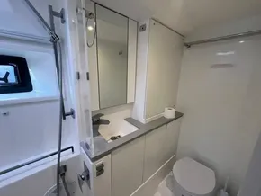 Modern bathroom in 2019 Leopard 45 yacht with shower, sink, and toilet.