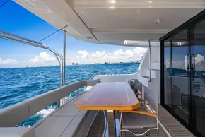 2025 Leopard 40 Powercat yacht deck with ocean view, featuring seating and dining area.